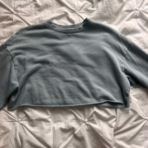 cropped light blue garage crewneck